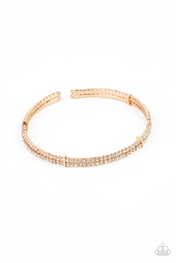 Held together with dainty gold fittings, two glittery strands of white rhinestones delicately curl around the wrist for a timeless finish.  Sold as one individual bracelet.